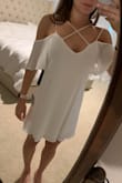 I like the look of the top and how it fits. Unfortunately, I'm not in love with the bottom. The under layer is uneven and you can see it through the outer layer. The material also wrinkles very easily, it looked like a different material in the main pictures. - Jordan B.