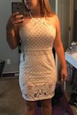 I bought this dress to wear at one of my bridal showers. I love how the lace is a less-traditional style, and the slit in the back is super cute. It is not as stretchy as I'd thought at the bottom, like for walking, but it's still a great dress and I can't wait to wear it! Fits like a glove. - Caitlyn N.