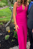 I recently wore this to a friend's wedding in August. The material was light and comfortable. It fit well in the waist and legs but was just a tad big in the chest/shoulders. I received so many compliments on this jumpsuit! - Erin S.