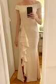 This dress is stunning. Material is high quality. It is a little heavy, so wouldn't wear to a summertime wedding, but for other seasons it's great. Flexible and comfortable for dancing, and fits wonderfully. I'm wearing 3" heels and with my height (5'8") the length is perfect. It's a little large in the chest, but I'm bottom heavy so I'll just get it altered. The pink is a little too close to white for a wedding, but otherwise perfect! - Lauren I.