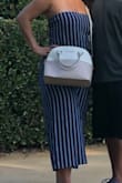 After reading reviews, I decided to go with a large. I'm thicker on the bottom and this fit great. I'm only bummed that I won't have much longer to wear it this season. - Tanya B.