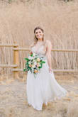 Dress was beautiful- I received many compliments. I did get the dress hemmed which I expected as I am on the shorter side. - Elizabeth T.