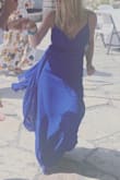 This dress is gorgeous. The only complication was that there is a ton of fabric and I had to tie it all up around me because it was so long. If I had worn huge heels with it maybe it would've worked, but I was in flats and it was way too long. The dress itself fit perfectly and the color is beautiful. You can see how I tied it in the picture. - Kathryn M.