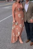 I was hesitant to buy this dress for a few reasons. 1. I'm fair skinned and I thought the dress might be too close to flesh colored to look good on me. 2. I don't really do the high/low look, or buy long dresses at all because I'm so tall and they never reach the ground as I feel they should. 3. I do not have a large bust and I wasn't sure how I would fill out the top. 4. I didn't know if it would conceal my belly area (which is poochy after 2 kids). I was wrong about it all. This dress looked great on my fair skin, was a great length on me (even with 4" heels - Taylor Blush Suede Ankle Strap Heels), it fit great on top (I wore adhesive cups that snap together in the front), and hid my mid-section extremely well! It was so comfortable to wear and flowed beautifully. My only criticism was that I felt like I had to hold the front closed when I walked because it opens all the way to the top, but that could've just been a personal insecurity. I wore it to a nice restaurant for my anniversary, but it would be perfect for a wedding too. My new favorite dress! - Niki G.