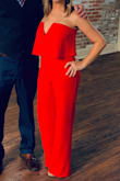 I wore this for my high school reunion and received so many compliments!!!  The fabric is very comfortable and stretchy. It was quite long for me, so I had to hem it about 3 1/2.  The biggest issue was figuring out what kind of undergarments to wear.  I ended up finding a plunging strapless bra that worked out perfectly.  The very top of the jumpsuit has what I would call gripper tape which helped the jumpsuit stay up the whole night.  So I wasn't constantly pulling it up and adjusting. - Lauren W.