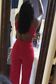 This jumpsuit is gorgeous! It looks very Elegant and Sexy and the fabric is good quality. I ordered it in Red and in Emerald Green and both colors are definitely eye catchers that will have you owning any room you enter. Also, both colors are perfect for the holidays so grab one before they sell out of your size. The length was a but long due to my height but wearing high heel shoes or hemming will work. Originally I ordered a size Meduim but it was huge so I exchanged it for a size Small. The 1st size Small I received was also too big so I contacted Lulus Customer Service and explained that according to their size chart I was size Meduim which was too large and the Small was also too big. I inquired if it was possible the size Small I received could've been a defect so the representative kindly expedited me another size Small jumpsuit which fit me PERFECTLY thank God. I love both of my jumpsuits. Lulus is a reputable company, with excellent customer service, and their orders are shipped out and received very quickly. Thank you Lulus for your beautiful, classy designs and great customer service. I would order 1 size smaller based on their size chart because the fabric stretches but if you want a much looser fit stick to the size chart... - Theodora F.