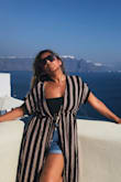 It fit was a perfect, it's not heavy and it's light and I didn't wear it as a swim suit cover up but as a regular cover up for when taking pictures in Santorini. - Christine S.