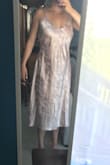 I have a short, athletic built so this dress was really long on me and shows a lot of imperfections from its satin material. It kind of made me look like I was wearing a long night gown. However, I think this would work for someone tall and thin! The cut of the dress is really flattering and is smaller in the waist. Despite this review, it is a beautiful dress! - Allie T.