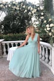 I felt like a PRINCESS in this dress! I wore it as a guest to a wedding since I would say the dress is more modest and simple. I did not expect much from it, but it turned out to be BEAUTIFUL! It flattered my shape and it was very comfortable! I definitely received a handful of compliments on it! 

I would recommend this dress! :-)

WARNING: if you are my height (5'4"), even with heels on, the dress was TOO LONG, which is why I stated that it ran a little larger. I had to spend the extra money to get it hemmed!! - Victoria M.