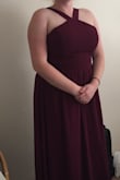 The material is very elegant. When I put this dress on in the size I would normally wear it was too small, but I ordered the next size up and it fit great! I really love the neckline. - Destiny A.