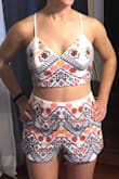 So this top is super comfy and I didn't need a bra. It looks amazing with the shorts!!! I didn't like how strappy it was in the back though :/ I just didn't find it flattering. I wish it had a thicker band along the back instead of all these straps because I usually have a roll of skin when I'm not standing up perfectly straight and facing directly forward. However.... if I was having my bachelorette party again, I would def keep this and only take photos from the front!!! - Allegra M.