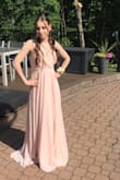 I had a really amazing experience with this dress, I wore it to my prom and I very much enjoyed the way it flowed nice and pretty. I got a small but maybe should have gotten an extra small because it was a little long even with heels and the bottom of the dress got grass stains on them. It's a little bit heavy, my only complaint would have to be that when I sat down the clothing covering my chest area kind of opened and separated a bit, nothing a little pin can't fix though! - Victoria F.