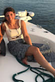 I looove this skirt! I'm 5'2 and it hits my ankles perfectly with sandals. It's so pretty for either a nicer beach dinner or casual travel clothes. I get a lot of compliments. The slit doesn't show most of the time, so you have to walk or sit for it to open up. It's not a tie, so your waist has to fit correctly. - Sofia S.