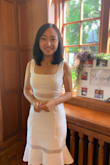 I wore this dress at my bridal shower and received so many compliments! It's very flattering and the quality is great! This is my first time shopping at Lulus. Once I saw this dress, I immediately decided that I would recommend Lulus to all my friends! Because the fabric is kind of thick, I don't have to worry about it being see through at all. I did have to tailor the top strap a little bit because I'm short and the straps are too long for me. But other than that, it fits like a glove! - Tiange X.