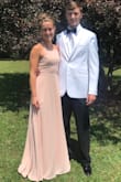 My daughter wore this dress for Teen Board. It was very comfortable. It washes and irons well. If you are contemplating which size to order, chat with the fit expert. I chatted with them and their advise was right on. The dress is very long and will need to be taken up unless you are very tall. My daughter wore 3" heels and it was still too long and had to be taken up. Other than the length being to long this is an amazing dress and great quality for your money. - Kim F.