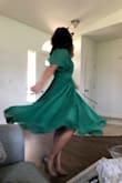 These dress is so cute! The green is beautiful and the fit is great. It moves beautifully and I'm obsessed with the length. I'm still a little confused on the correct way to tie this though since one string seems to be on the inside while the other is on the outside, making tying it a bit weird. - Erica M.