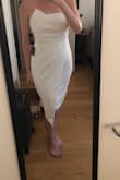 Very flattering and "wow" look. Top did slide down a bit but to be expected with strapless. Thick fabric and really nice cut. Would recommend! - Michelle M.