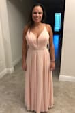 I bought this dress to wear as bridesmaid in my friends wedding. It fits great and is super comfortable! I love the back because you can tighten as needed. I only needed to get it hemmed. - Marissa C.