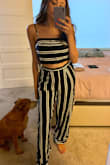 This 2 piece outfit is so cute and trendy. The bottoms are a little small, it felt really snug on my waist. The bottoms are also very long. I am 5'7 and they were still dragging, but if you wear high heels then that probably won't be an issue! The top was true to size and a perfect fit. - Stephanie S.