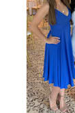 I bought this as a wedding guest dress. I ordered a size up, M due to wanting to make sure the top fit right. The fabric is super comfortable and once pulled tight enough, feels amazing. Cannot lace this up yourself so you need another person when wearing and possibly taking off. I have it as tight as it possibly can go so maybe if you're smaller in the bust (I am 34DD) it won't be a problem as a S but if you want a little more coverage, a M is perfect. My only complaint is the fact that I need a S and the top is just borderline small even in a M. However, Iâve worn twice and will be my guest go to dress for summers. Also, color is true to photo! - Kayla A.