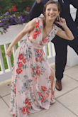 Although the dress was really long and I had to hem it (only 5") the draping was gorgeous. The slit was high but still tasteful, the amount of cleavage was a little much for a wedding and I sewed it shut a little. 

This dress has a v back, front and sides and I found it impressive that despite that it didn't budge. (See photo of my fiance and I clowning around).

I loved it so much I'm waiting for it to come back in purple. - Hailey C.