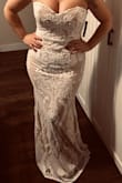 I am going to get it altered as it is a bit loose around the chest and waist and is much too long. I'm wearing 4" platforms in the pic that you can't see but I'm quite short. It fits quite nice around the hips, which is the area that's always too snug on me! - Andrea M.