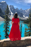 The dress ran a little big but was fine since it is a wrap dress. I actually ordered a Medium and a XL in this dress that's the only sizes that were available. Based off size chart I needed a large I ended up keeping the medium (as pictured). - Ashley D.