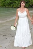 I bought this dress to wear to our beachside 20th Anniversary vow renewal ceremony in Jamaica, and it was perfect! It was the right amount of tastefully sexy without looking inappropriate. The adjustable tie at the top could have been an inch or 2 tighter for me, but the bodice was thick enough to not need a bra and offered enough support. The only problem I experienced was that the lining hung unevenly below the outer layer. I had to pay a local tailor to press out the wrinkles and then cut the layers to hang correctly (I feared tripping on them!?). I only gave it 4 of 5 stars b/c of that needed alteration. - Angela D.