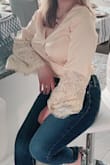 This is a beautiful top, very feminine and material is soft. However, it is quite hard to get it on as it is tight somewhere in the shoulders but opens wide in the bust area. You need a pin to secure it in front. - Florevelle P.