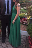 LOVED the color green! The dress wasn't tight which is what i wanted. It was so comfortable! I was able to move and eat without feeling like i was going to burst out of it. The straps in the back are adjustable which i really loves as well. The length was perfect with heels but i was stepping on it a lot when i took my shoes off. If you are shorter you will need to get it hemmed. - Jennifer D.