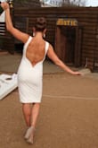 This is the best dress I've ever owned. I wore it to the White Party I threw for my birthday and got a ton of compliments. It's a perfect fit (true to size) and the back has some boning/wiring on the bottom so it maintains its shape (but is super comfortable.. I have a short torso and the low back was still perfect. Though if you're short generally (and I'm 5'3) the dress itself may feel a little long (I had to hem mine quickly about 2"). Recommend!! - Katie L.