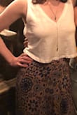 I love the fun pattern of this skirt. It's a lightweight fabric and it's a little tight around the waist but still fit fine- my normal Lulus size is a S. The slit in the skirt does open all the way if you're not careful! I usually wear it with a white crop top and sandals for a casual evening out. - Rhianna V.