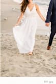 I love this dress. The fit was perfect. I wore it for my engagement photos and I am so glad I did. This dress can be easily dressed up or down. It can be casual or elegant. I did need to get it hemmed, but that didn't bother me. The top fit perfect and the bottom flowed beautifully. Highly recommend. - Megan C.