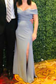 I wore this to a wedding reception and it was gorgeous! The slit was just right. I did noticed I had to keep pulling it up as it would fall a little too low off the shoulders, but it didn't bother me much. It does show every bump and curve, but was nothing that spanx couldn't fix! I received lots of compliments on the dress - highly recommend! - Halee R.