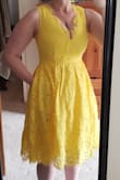 Fits a bit snug, but not too tight. The neckline dips very low, so be prepared. But the lace fringe does help cover a bit. Great colour. Great pockets. There's a layer of tulle between the lace and the slip, so you'll always have poof in the skirt. 8/10, would buy again. - Monica G.