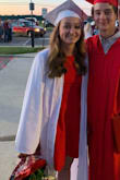 The fabric is thick but I was never hot underneath the hot lights of graduation. The dress was a little loose at the top but was easily adjustable with the ties. I loved this dress and it fit my school colors wonderfully!! - Addy W.