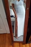 I ordered this dress for my engagement photos. I originally went with the blue in a size up after reading it was tight in the bust area. I was way too big so I returned for my actual size L in white and loved my choice. It fit perfect all over, even in the bust area. Great quality and very forgiving in white. I received so many compliments on this dress and would recommend. - Jasmine M.
