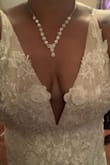It runs a little large in the waist and bra area but perfect around my hips. I really like the dress. And I love the plunging neckline. I ordered a XL if I chose this dress I will have to get a large. - Michelle R.