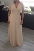 This dress is exactly what I hoped it would be. It accentuates the curves and flows nicely. It is a bit long and the v-neck line is very deep. had to pin the top and hem the bottom but it worked out. - Michelle G.
