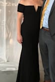 I wore this dress for a bridesmaid dress in a wedding, and I loved the fit and style! I got so many compliments, it hugged in all the right places and was very flattering. It's a thicker material than other Lulus dresses I tried on, which I was worried about if the wedding was a hot day- but it ended up being a cool day and it was perfect! My one compliant is that I must have gotten the dud of the batch that was poorly constructed because the inner and outer linings kept shifting on me ALL night long so I kept having to twist the dress to line back up properly. On the dance floor it would shift so much that the base of the zipper on the back would end up at the side of my hip (instead of the center of my back)! I just could not get the inner lining to stay put, which I think is because it was made off center. Really disappointing to have to do for a bridesmaid dress, but I did love the style - Kelsey T.