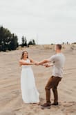 Wore this dress for my engagement pictures and it was absolutely perfect! Flowy and flattering. The top was a little tight but not too bad... wore a sticky bra because the sides are a little sheer! - Hannah D.