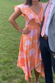 I got so many compliments on this dress! Great material! Does run a bit big in the bust area so had to pin it so my bra didn't show. Loved the wrap around! So great for a wedding! - Chelsea M.