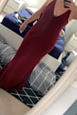 I used the measurements to pick a size and was trying to decide between L and XL. I went with L and when it arrived it was too large. I ended up returning and ordering a M in a similar dress from Lulus. It was a beautiful dress and had it fit better I would have kept it. The material is thick in a way that it smooths over imperfections and is very stretchy so I would for sure size down. I also felt that based on photos it was more of a wine red but it was purple toned (which makes sense given that the colour is called plum purple but I was expecting a red base). Beautiful, well-made dress, but the fit just didnât work for me. Also, I was concerned about duty charges since I ordered from Canada but there were none! - Terry B.