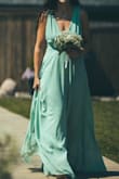 Wore this as a bridesmaids dress for my best friends wedding and it fit mostly perfectly. The length was perfect on me for being 5'9 and wearing a little wedge heel. Only con was there was a little bit of gaping where my armpits are but nothing horrible. - Katie Y.
