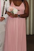 The overall fit is good. The top part is a little big on me. I don't think I would down size just have it altered and some of the bottom cut. I absolutely love the dress. It is the perfect color for the wedding that I will be in. I love it! - BreAnna R.