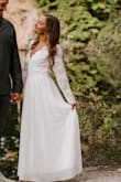 I ordered an extra small. It was extremely long and the lace sleeves were lose. But It's great material and is durable fabric. Once I got it hemmed, it was stunning and I loved it! - Kaci W.