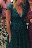 Love this dress and received so many compliments (esp the back of the dress) at the wedding I attended! It fit great overall but as other reviewers mentioned, it is bigger in the chest area (but I'm also small chested). Pro tip: I bought $8 bra inserts/push up pads and attached them into the bust of the dress with fashion tape. I didn't need to wear a bra (hello backless dress)  it filled out the extra room in the top and no one was the wiser. I can't wait to have the chance to wear this dress again! It's a gorgeous green color and the dress seems very well made with quality fabric. - Mariah L.