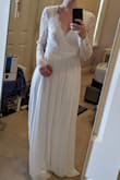 Photo shows when I first tried it on. I got it hemmed an inch on the bottom because I don't wear heels higher than three inches. It runs a little big on the arms.
Otherwise I got a ton of compliments - Samantha W.
