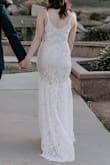 This was an amazing, affordable, beautiful wedding dress. I got married at the courthouse in San Diego and wanted something comfortable and relatively casual. I was not interested in spending a lot of money on a dress I would only wear once or twice. This dress was perfect for the occasion. I actually did not like the dress much when I was trying it on initially - the color was too dark/nude when I was trying it on in my bathroom under that lighting. Outside in the sun though the dress was gorgeous and white and bright, and the lace looks perfect in the sunlight. It photographs very well. The train makes the dress more elegant and it looks more expensive than it is. No one could believe this dress was only $100. I did not get it hemmed because I thought it would be difficult to hem the lace trim, so I wore 4 inch wedge heels and that worked well. Highly recommend this dress!

Should note though that the lace shown in the picture on the model is NOT the lace pattern that arrived in the mail. I talked to customer service about this and apparently they have no control over which lace pattern is used, and based on the shipment you get, it may be a different lace pattern. They were very polite about this, and offered me a $20 gift card for the inconvenience, which was much appreciated. As someone who did not want to go try on any dresses in a bridal store, the free online shipping and return was a godsend. Thumbs up to Lulus, would buy again for sure. - Sally Y.