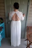 I am a curvy girl who thought no way in heck this dress would fit I usually wear a Large but after reading the size chart got XL and it fit near perfect. Not much stretch on the waist so check your measurements! I will need to get a special bra (the photo I attached I am not wearing one) so expect more lift then pictured. It is a bit loose in the arms which is a easy and cheap fix. Paid 76 total you just cant beat this wedding dress. So happy! - Kristen K.